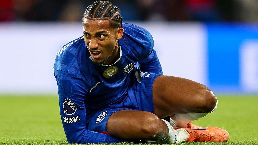 Joao Pedro lying on the ground