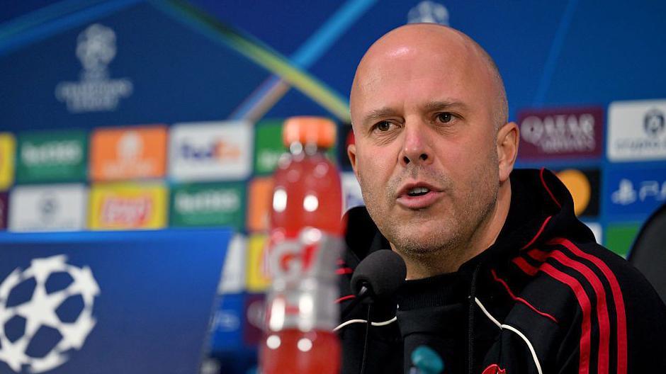 Arne Slot at a news conference for their Champions League game against Inter Milan