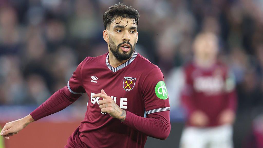 West Ham's Lucas Paqueta in action against Aston Villa in December 2025. He has black hair and a beard. West Ham's shirt is claret with the club badge on the left breast and Umbro logo on the right.