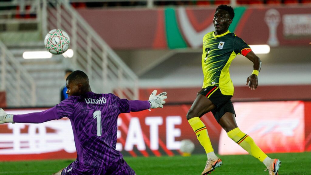 Rogers Mato chips Nigeria goalkeeper Uzoho to score for Uganda at Afcon